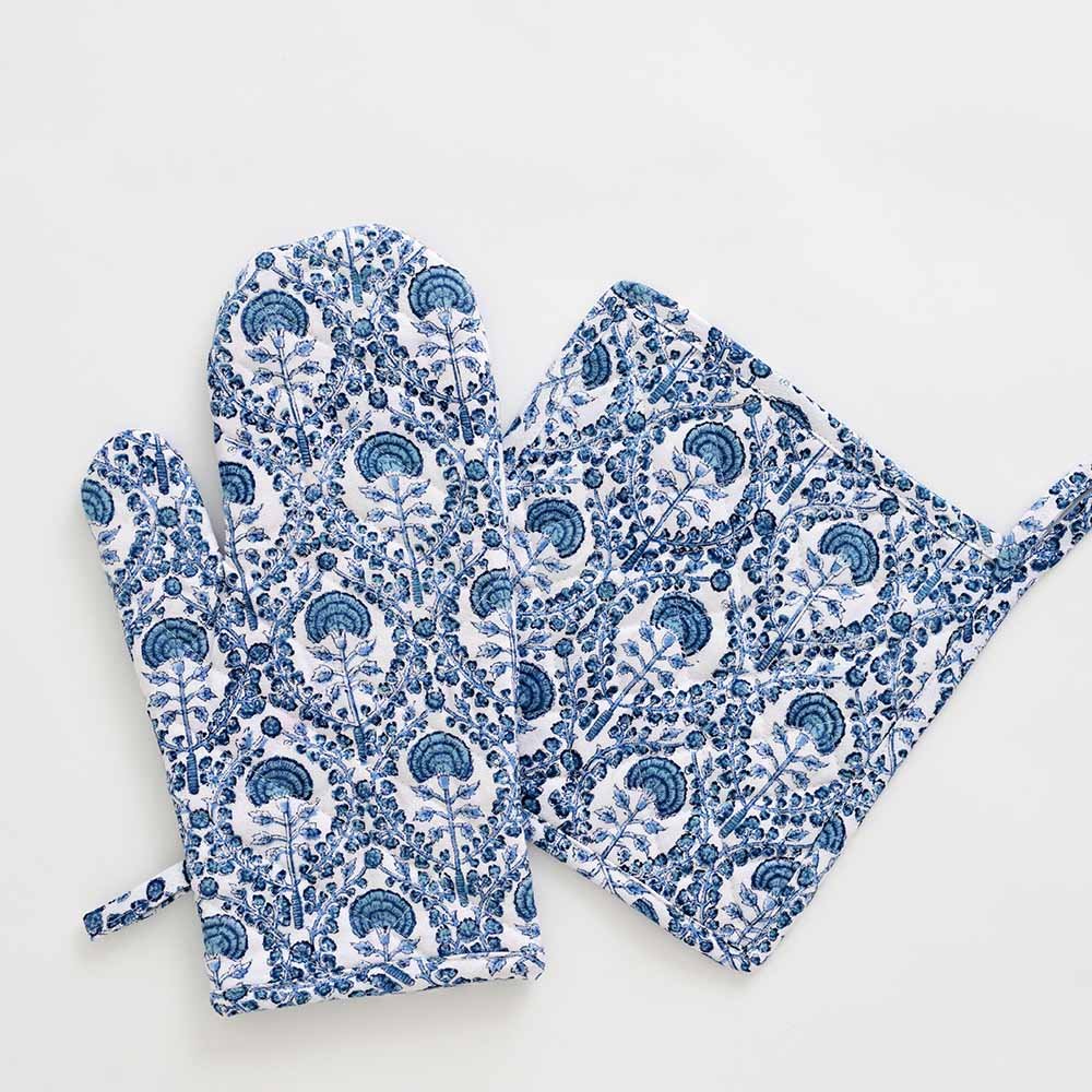 Warm blue hues paired with solid white to give a modern yet global look to this oven mitt set. 