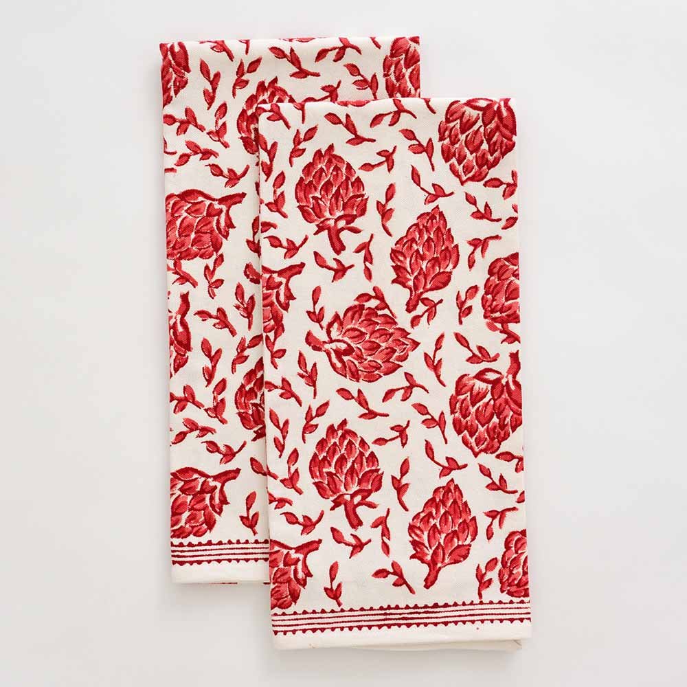 Red and white hand painted tea towel set with lined border details. 