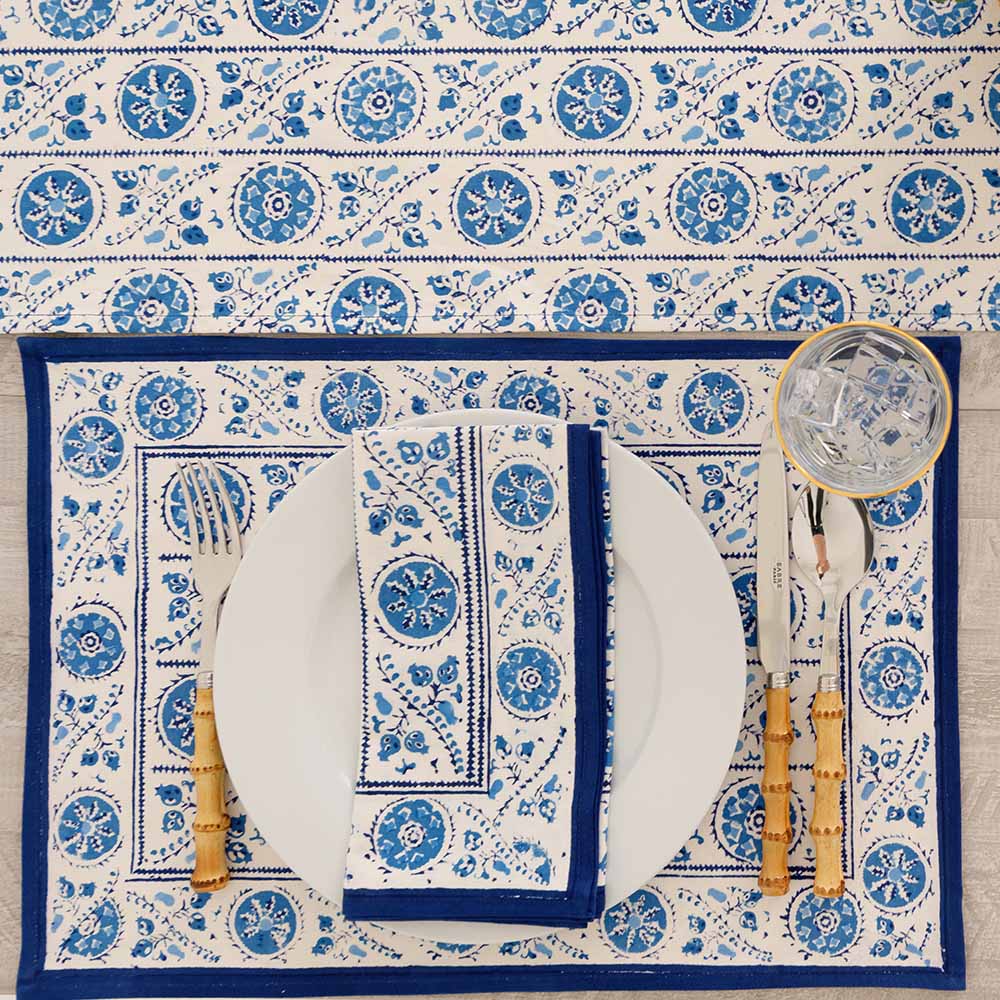 Matching placemat, napkin, and table runner. 