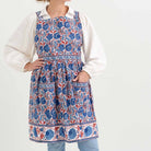 Apron designed in blue and paprika orange hues. 