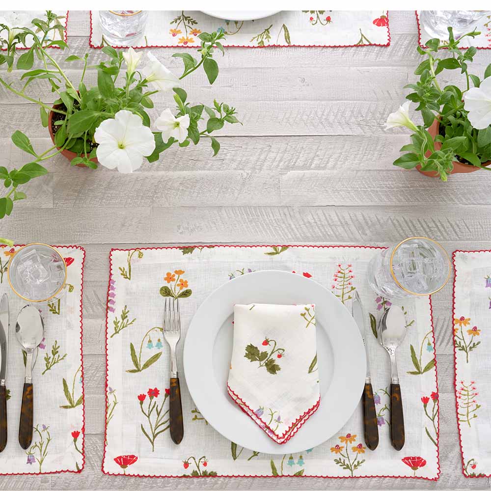 Placemat paired with matching napkin. 