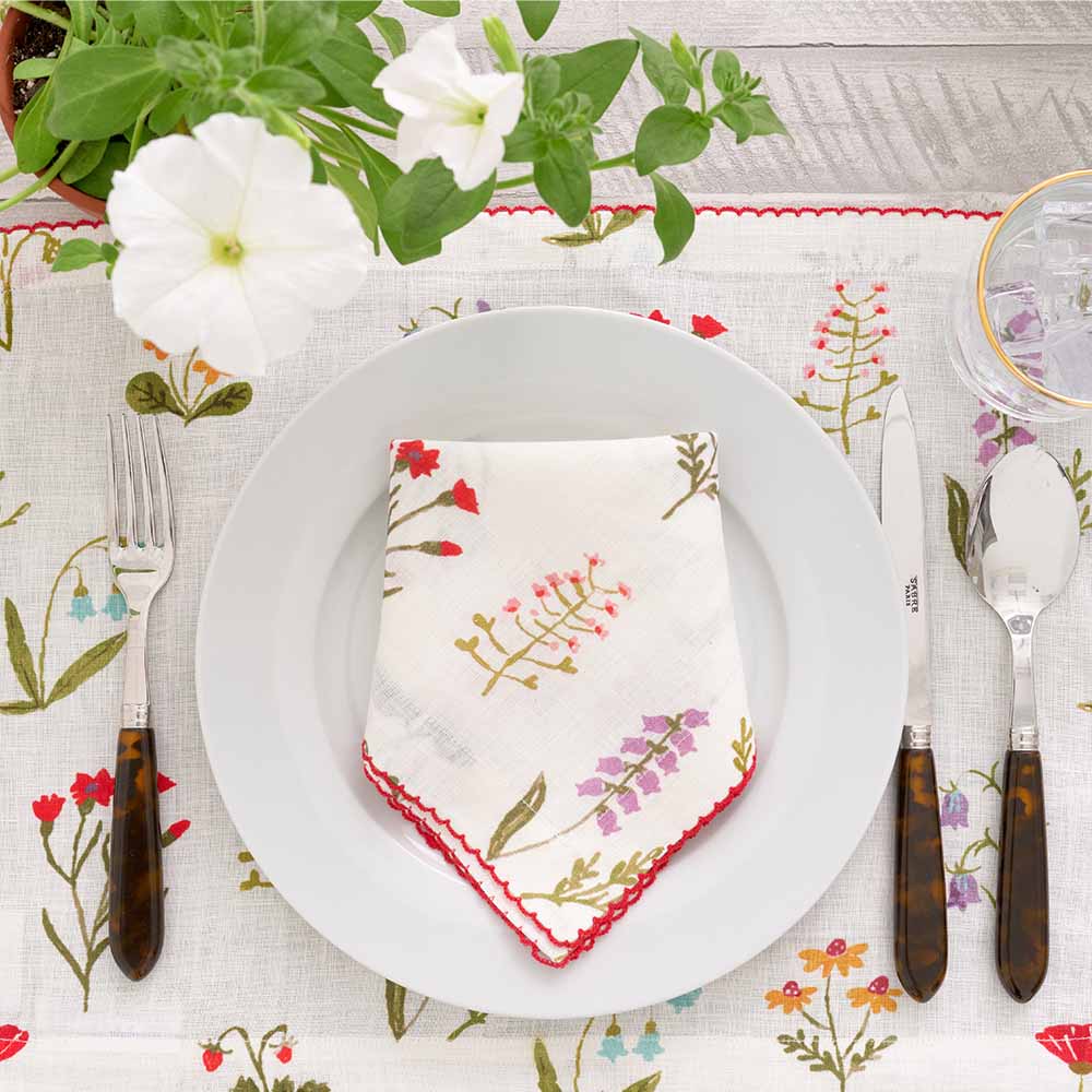 Botanical Garden napkin and table runner on a set table. 