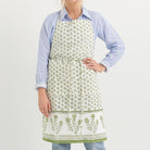 Model wearing Phlox Green apron. 