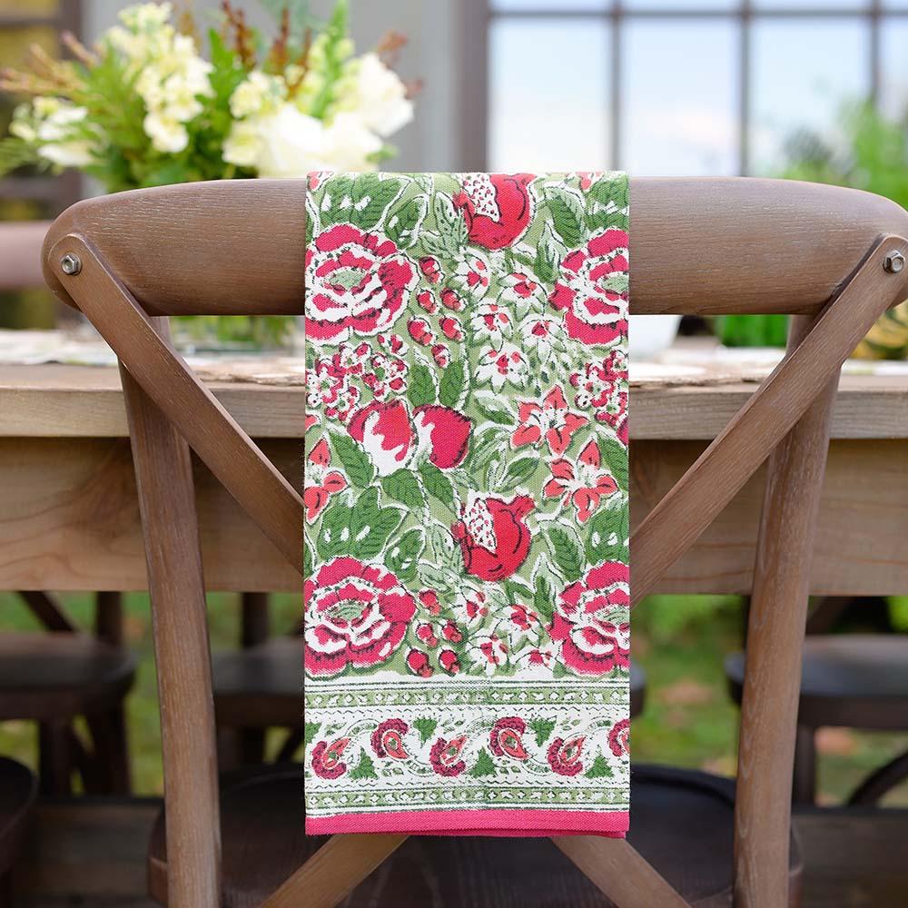 Autumn Orchard tea towel hanging on back of chair. 