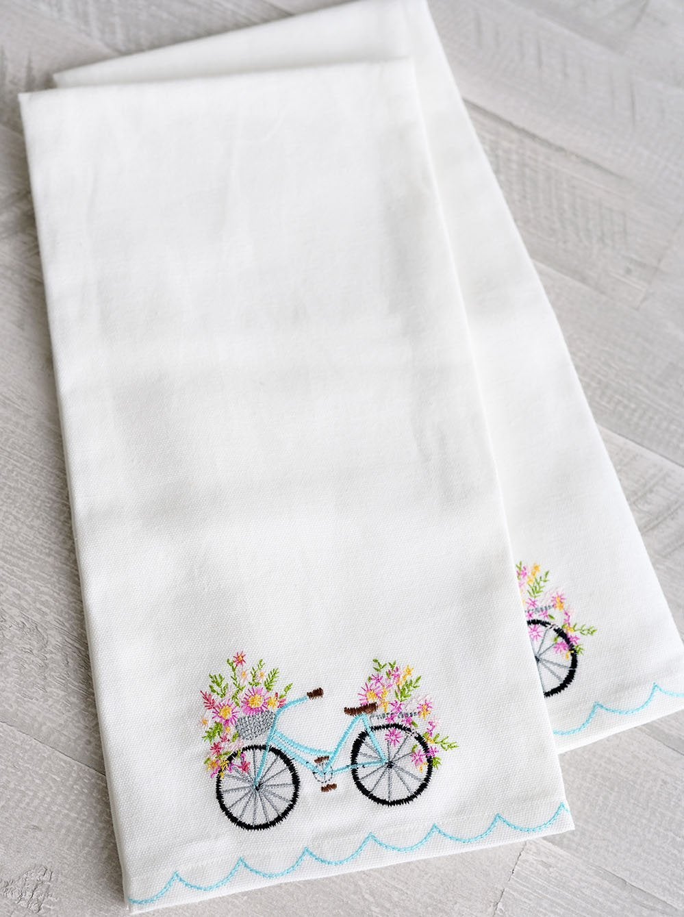 Blossom Bike Tea Towel on white towel