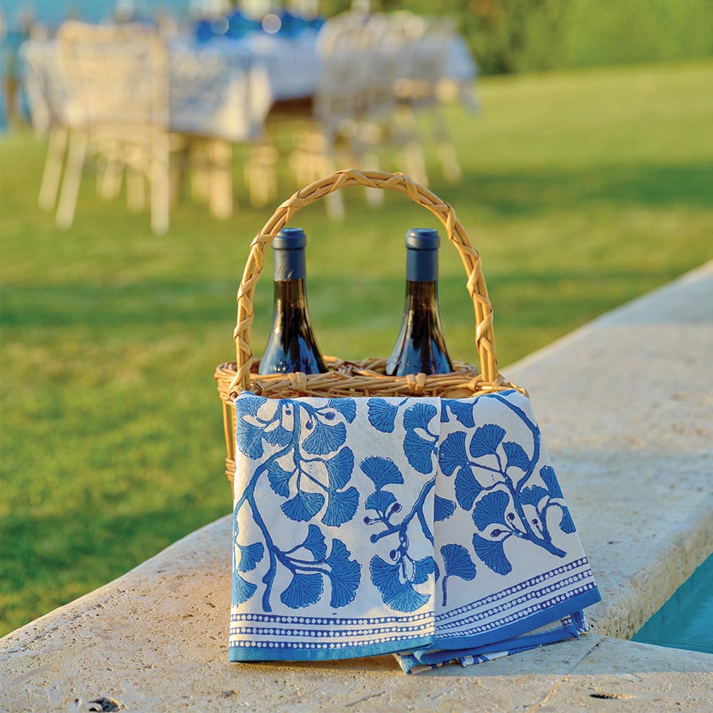 Tea towels draped over wine basket. 