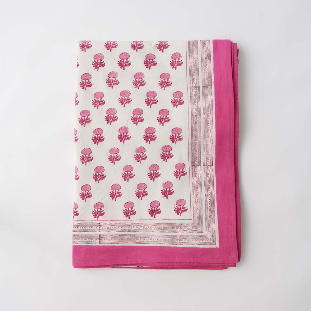 Rose floral quilt with hot pink border. 