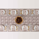 Overhead shot of elegant dinner table with pinecone centerpiece. 