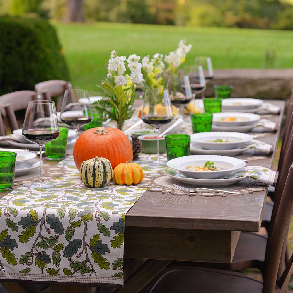 Maple & Acorn table runner with pumpkin decor. 