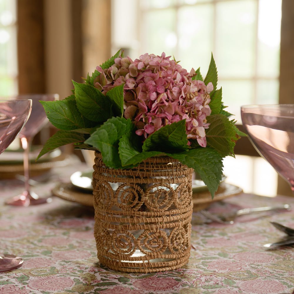 serpentine votive with pink flowers