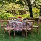 bohemian floral tablecloth on round table outside