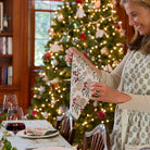 woman folding Christmas Garland Napkin