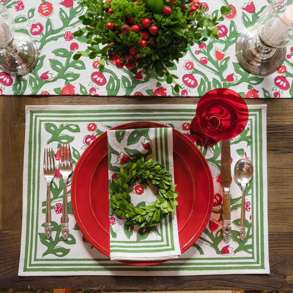 emma red & green napkin on red plate with mini wreath and matching placemat