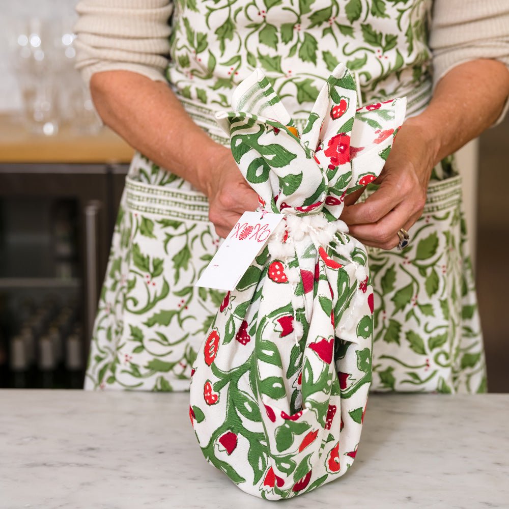 Model Wrapping Present with Emma Red & Green Tea Towel