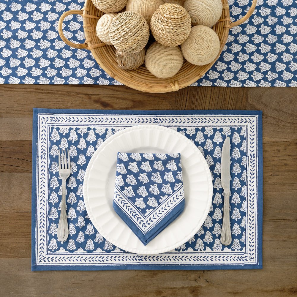 Pom Buti Denim Blue and White Floral Placemat with matching napkin and table runner