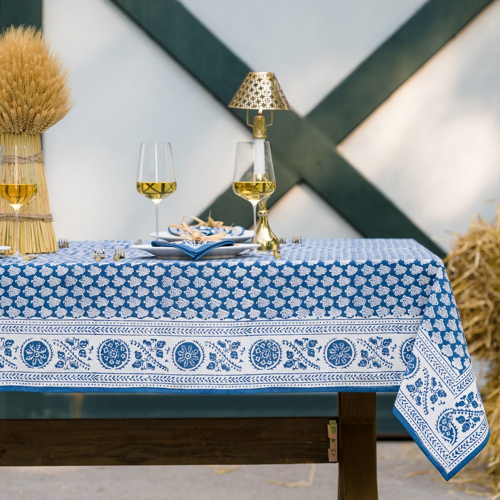 outdoor table with pom buti denim tablecloth and matching napkins