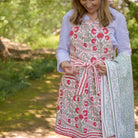 Model wearing Cactus Flower Scarlet & Rose apron