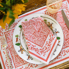 Tapestry Persimmon napkin on plate with matching placemat