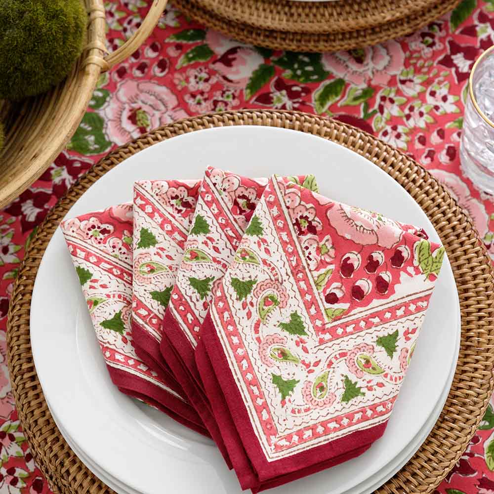 Napkin set folded on white plate. 