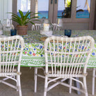 Emma Tablecloth with white chairs.