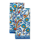 Iznik tea towel with tea towel set edged with an abstract geometric pattern in two shades of blue and a solid blue border