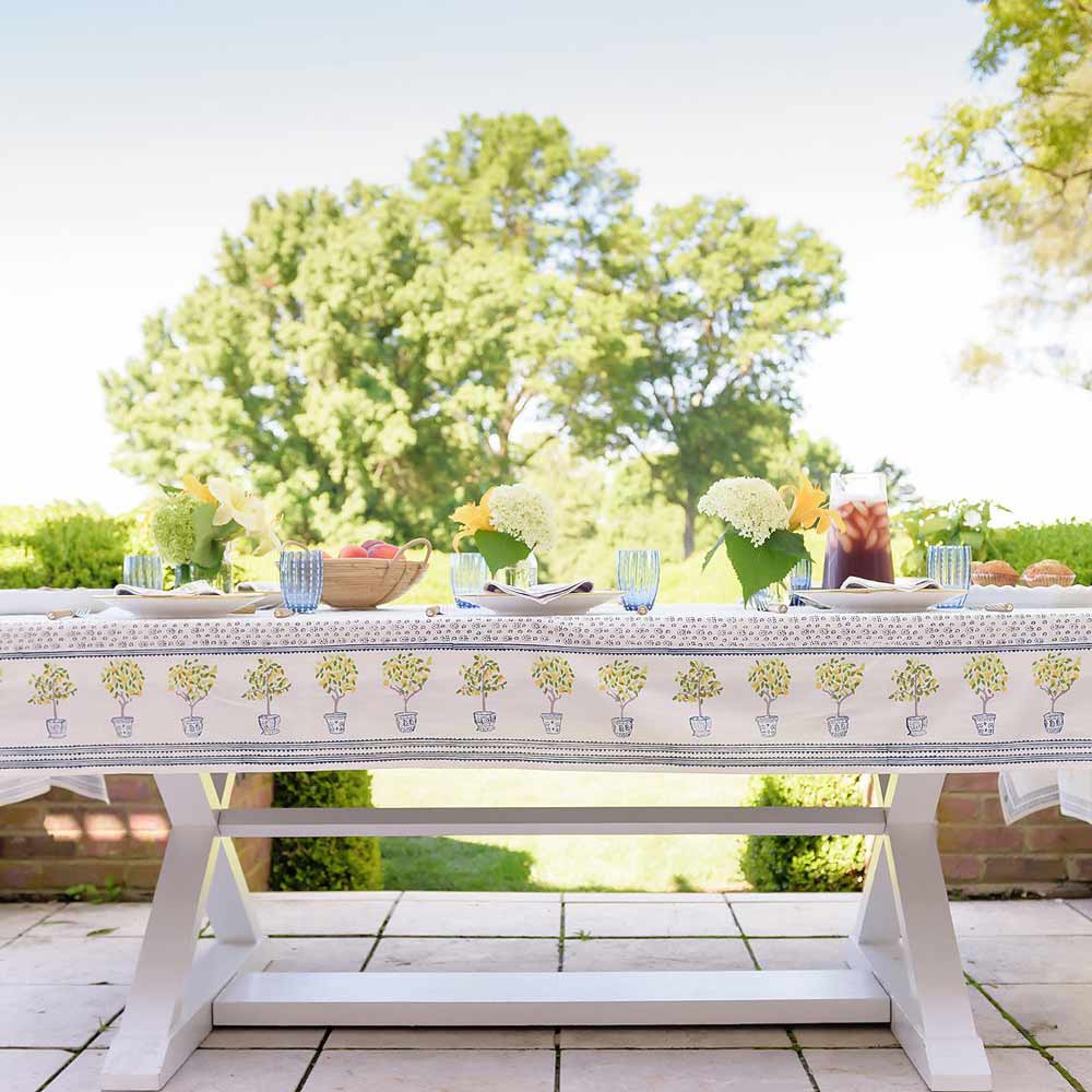 Blue and yellow patterned linen with topiary.